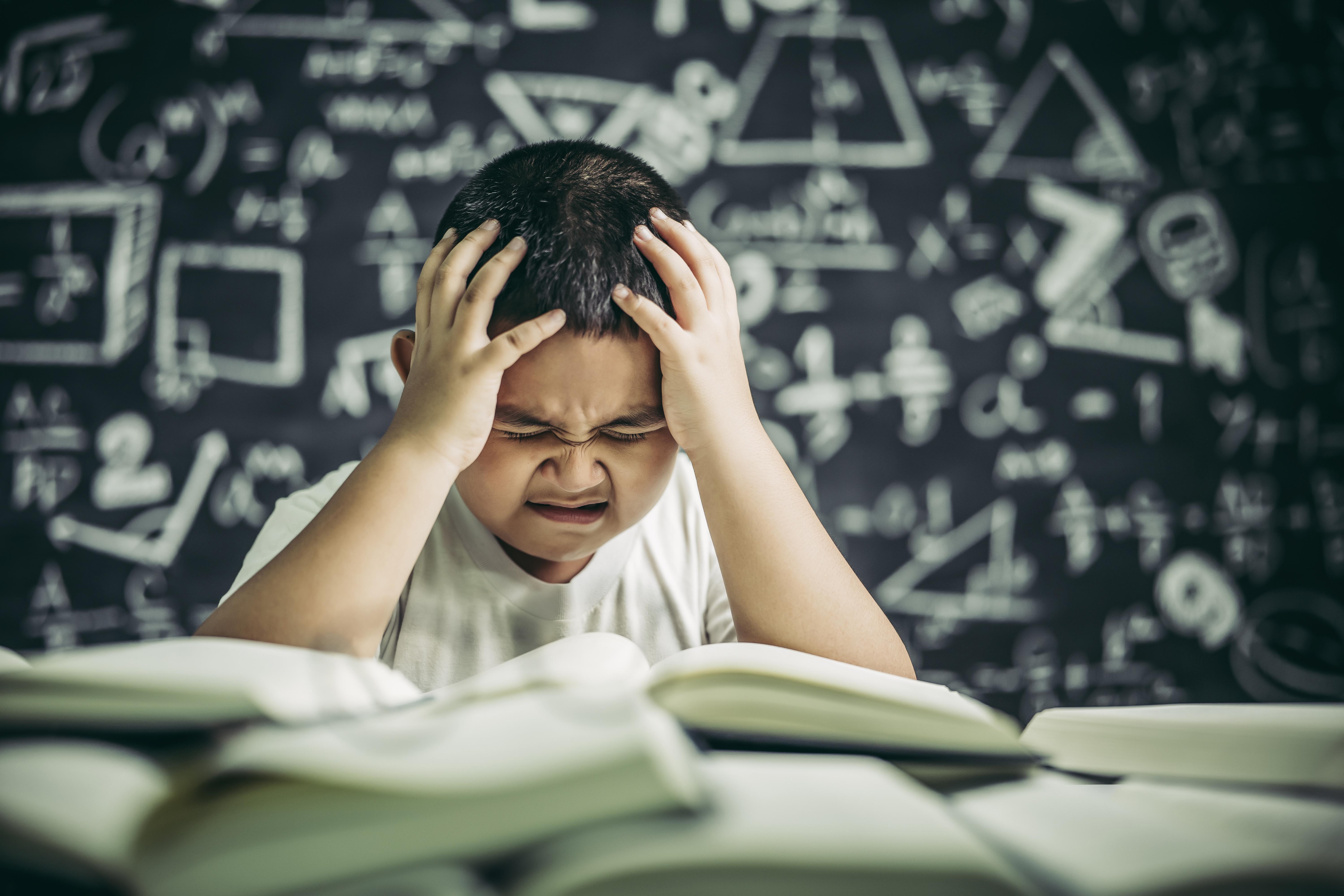 boys-with-glasses-write-books-think-classroom