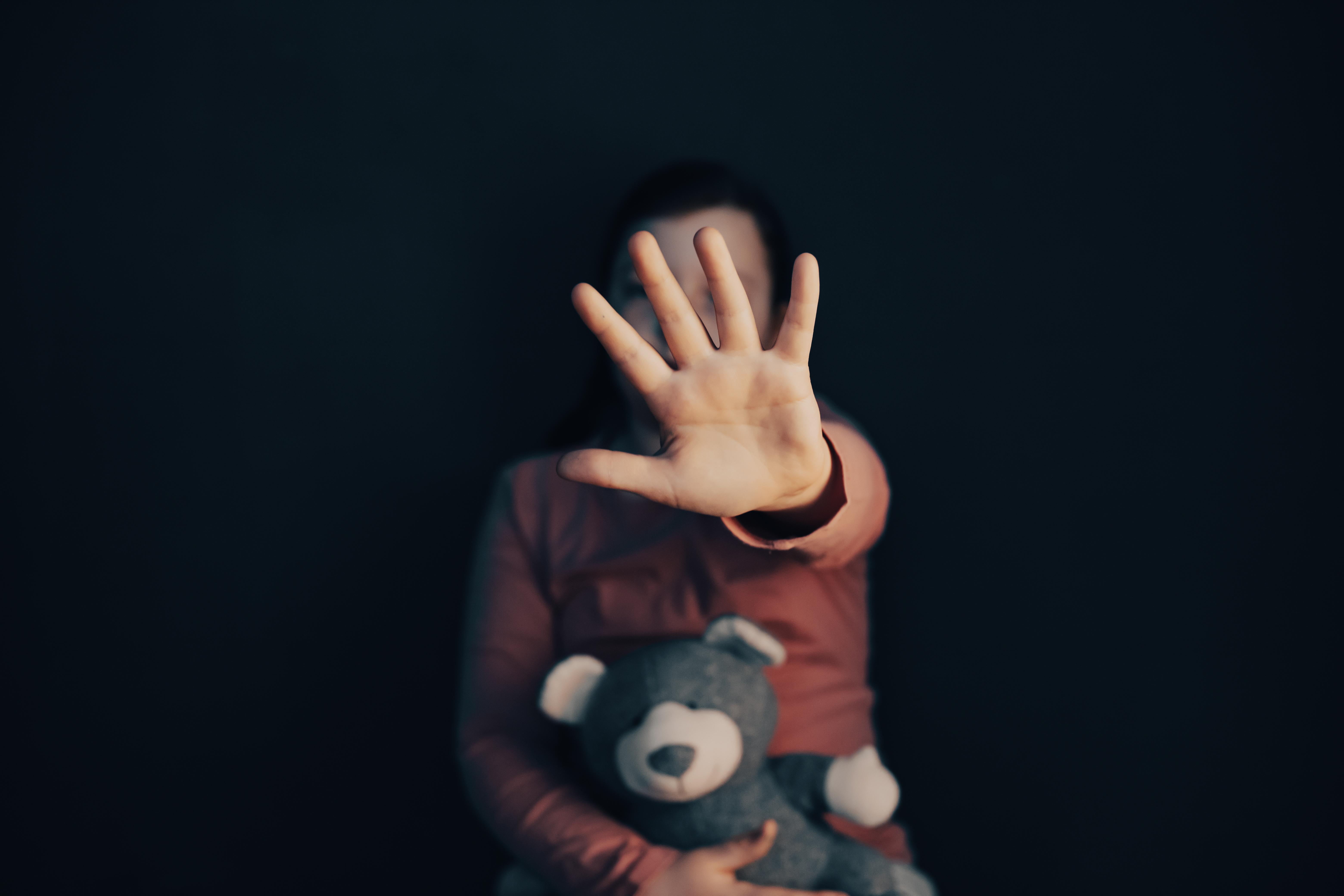 close-up-human-hand-against-black-background